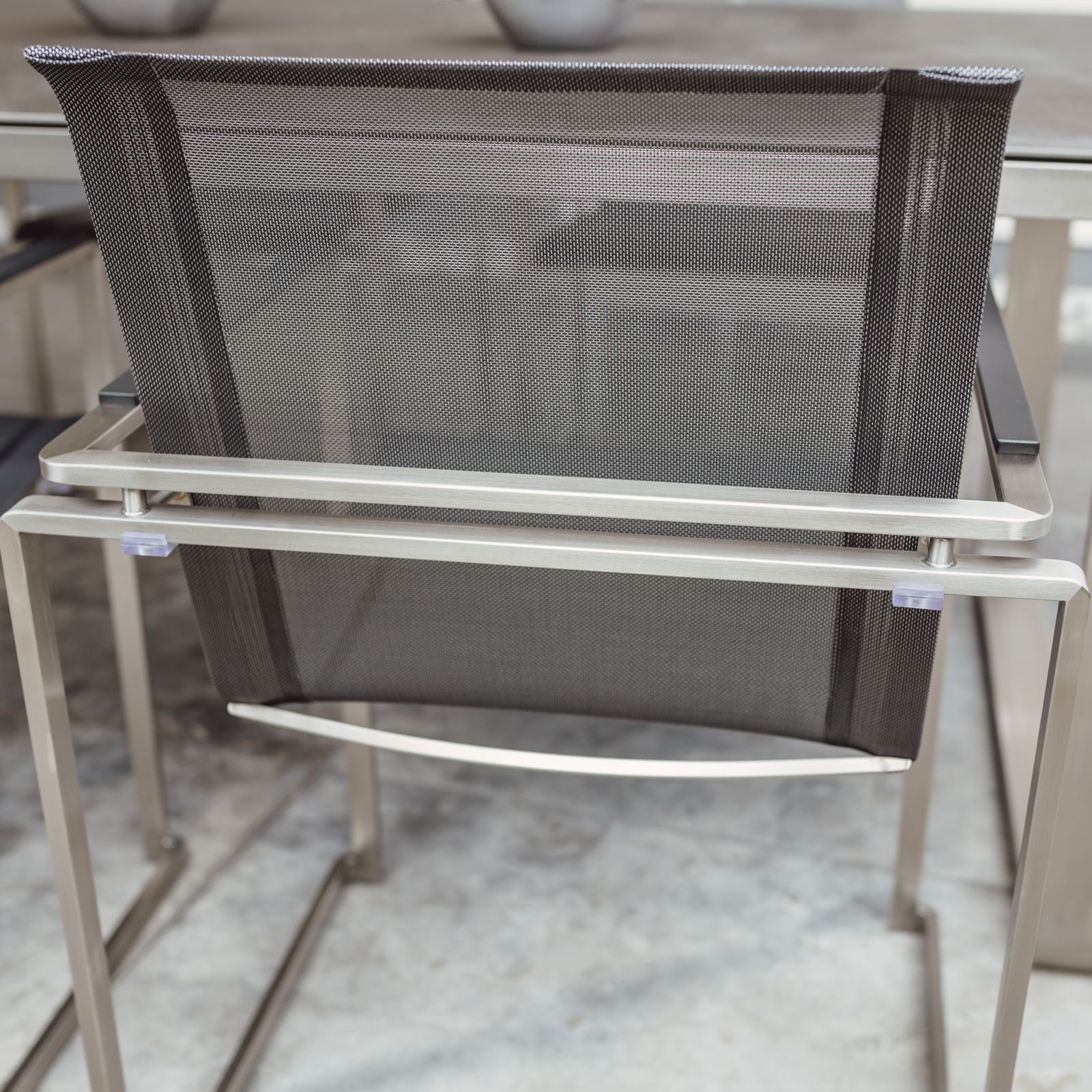 Tuinmeubelset: 6 stoelen en 1 tafel in roestvrij staal en glaskeramisch tafelblad